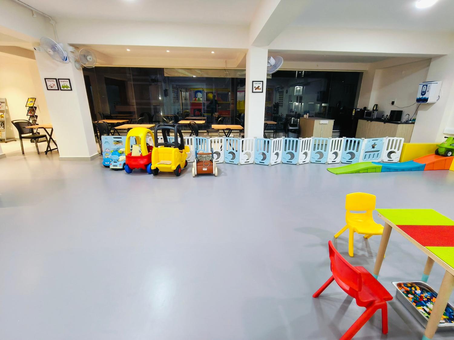 Open play area with ride-on cars
