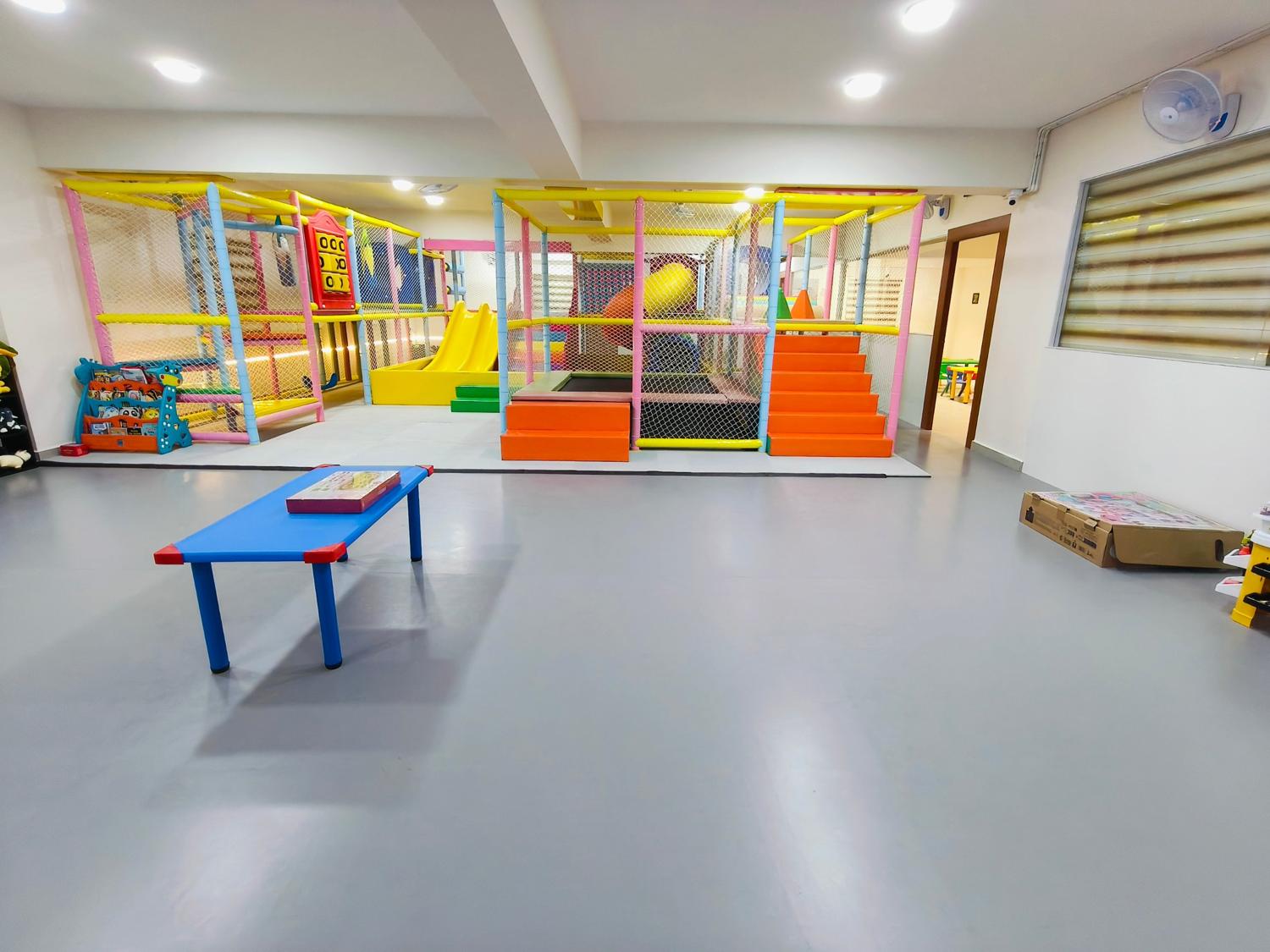 Soft play structure seen from the open play area
