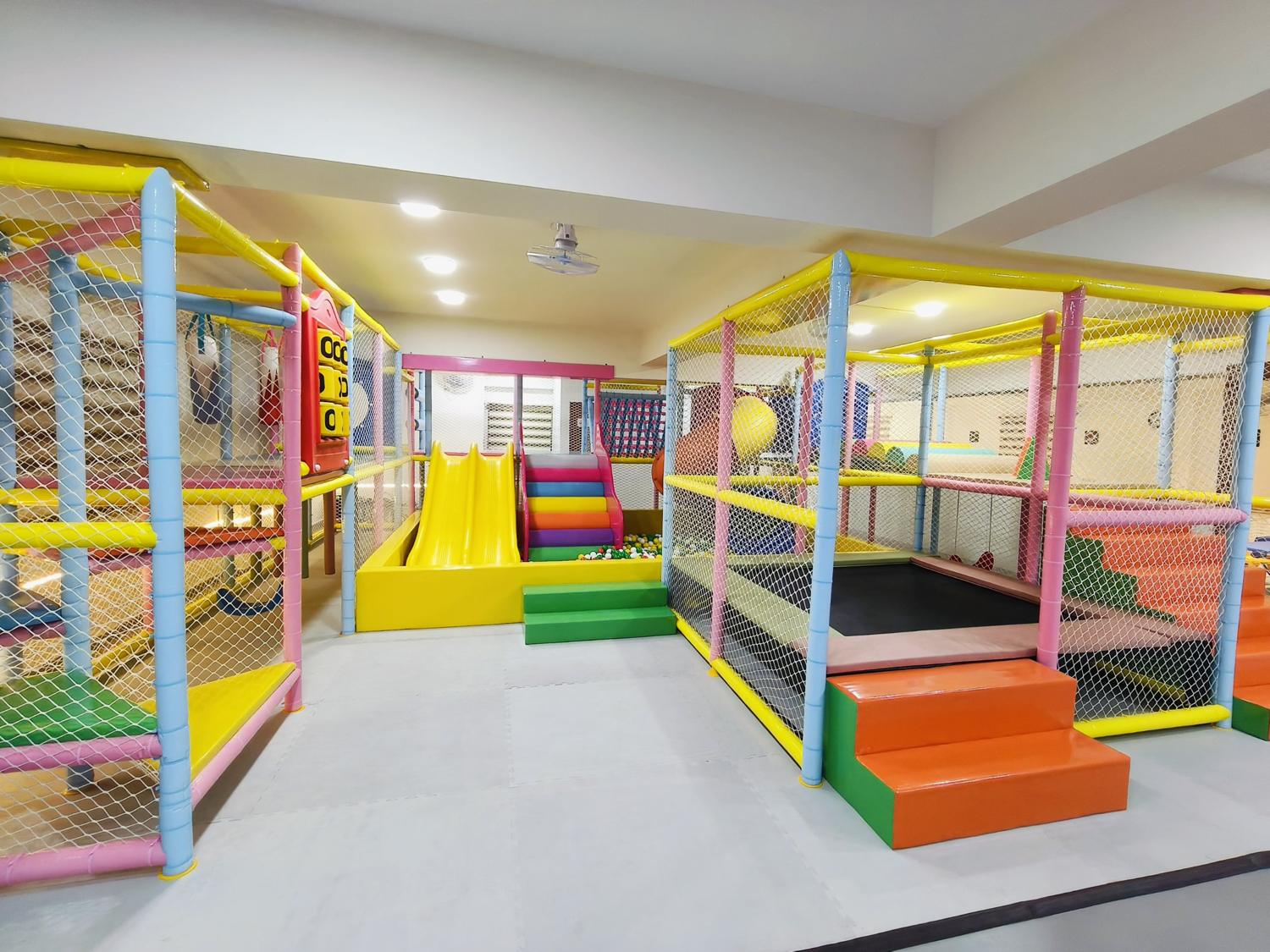 MoonHop soft play structure with slide, rainbow steps and trampoline