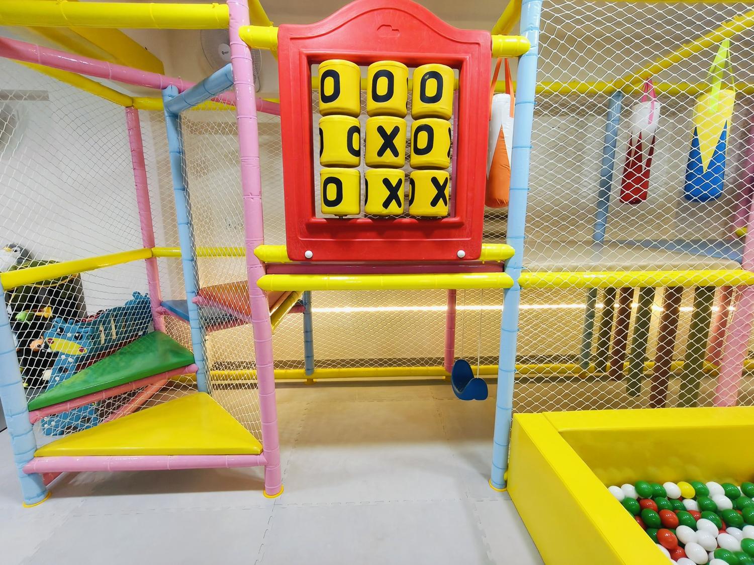 Giant tic-tac-toe panel and hanging punch bags
