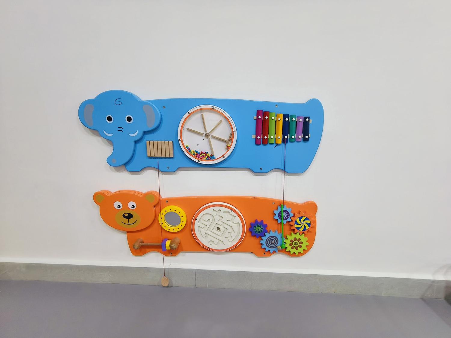 Elephant and bear activity wall panels with xylophone, maze and gears